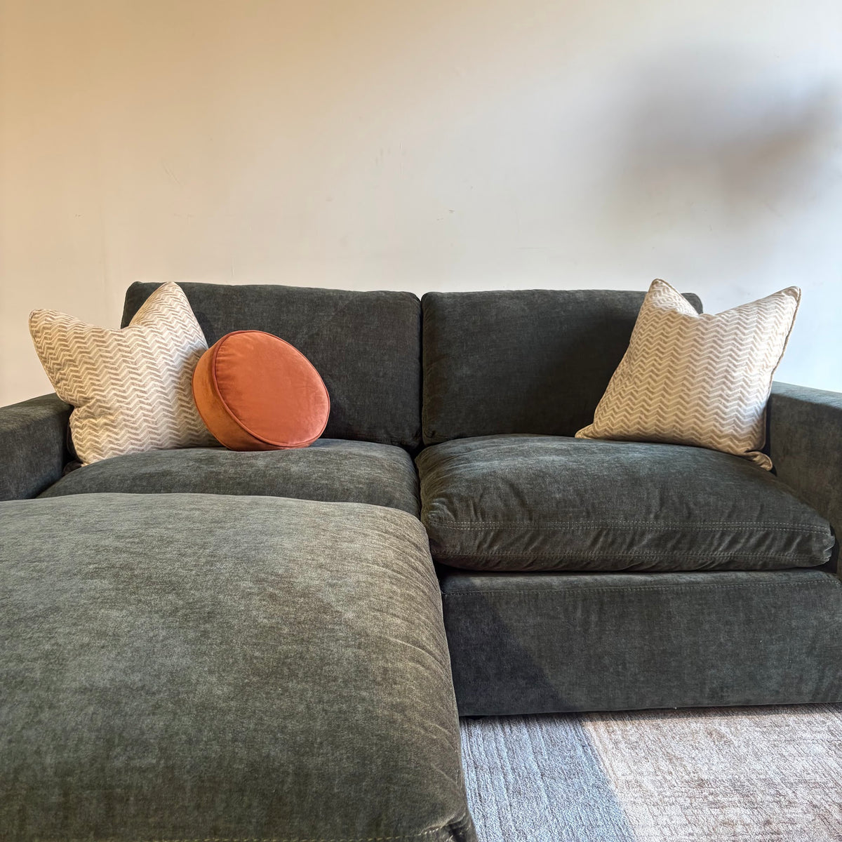 Cypress Loveseat + Ottoman in Velvet Forest Green, front close-up