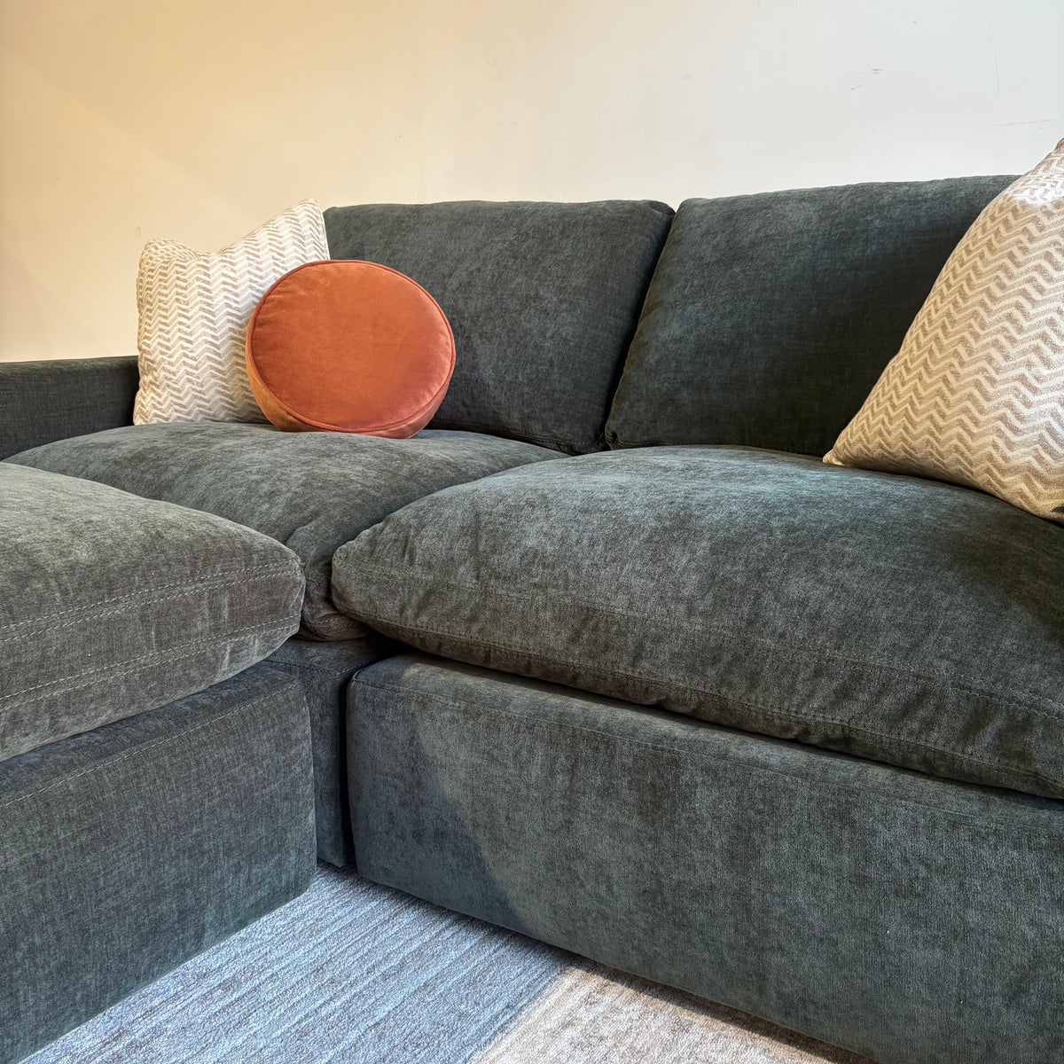 Cypress Loveseat + Ottoman in Velvet Forest Green, right close-up