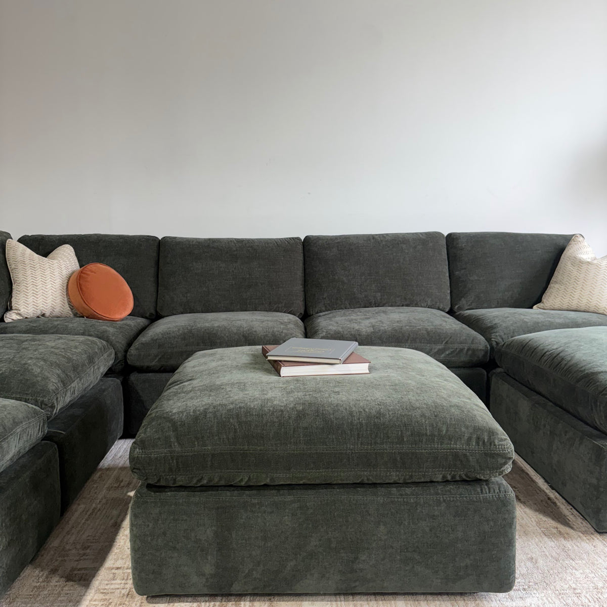 Cypress Grand Corner + 2 Ottomans in Velvet Forest Green, front close-up