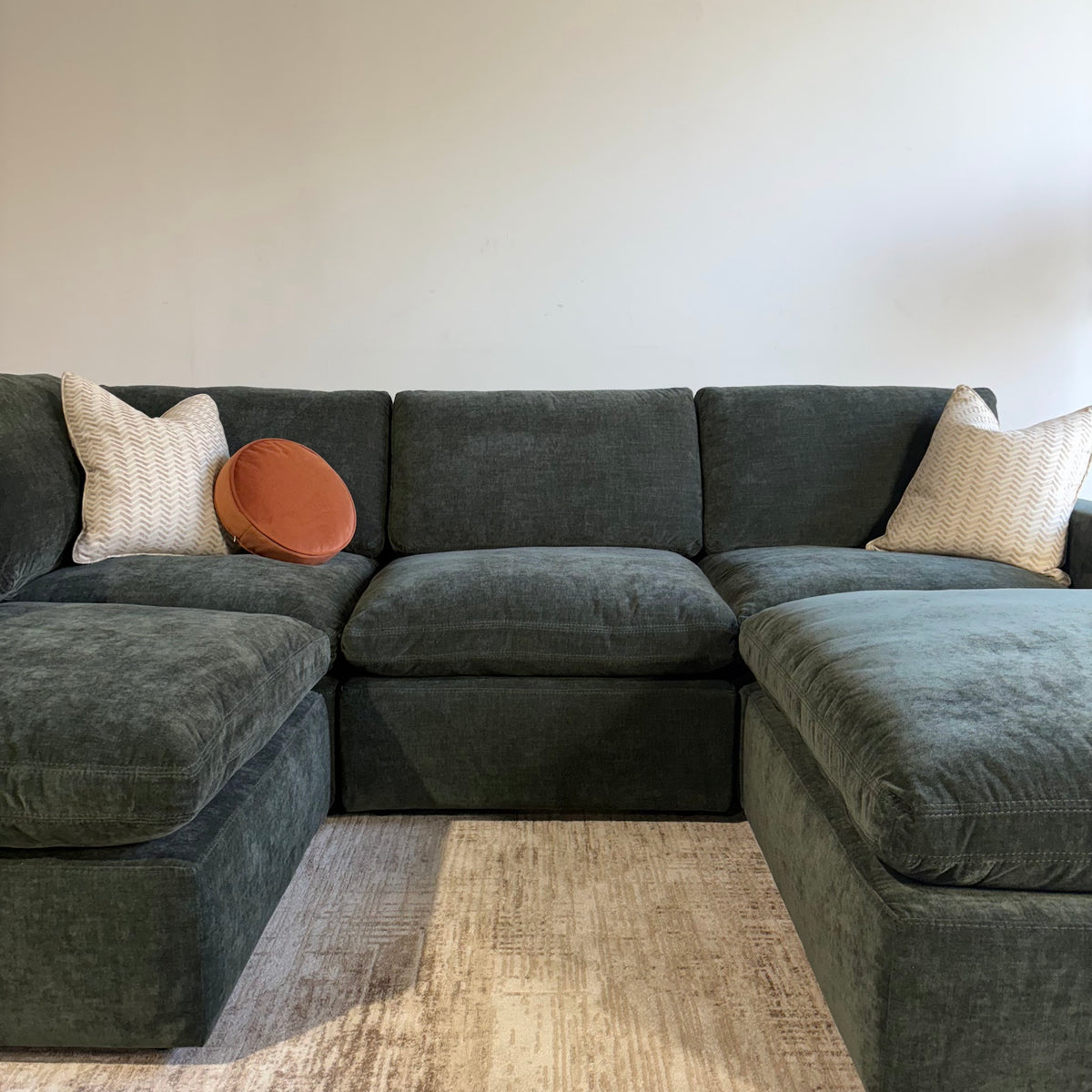 Cypress L-Shape + Ottoman in Velvet Forest Green, front close-up
