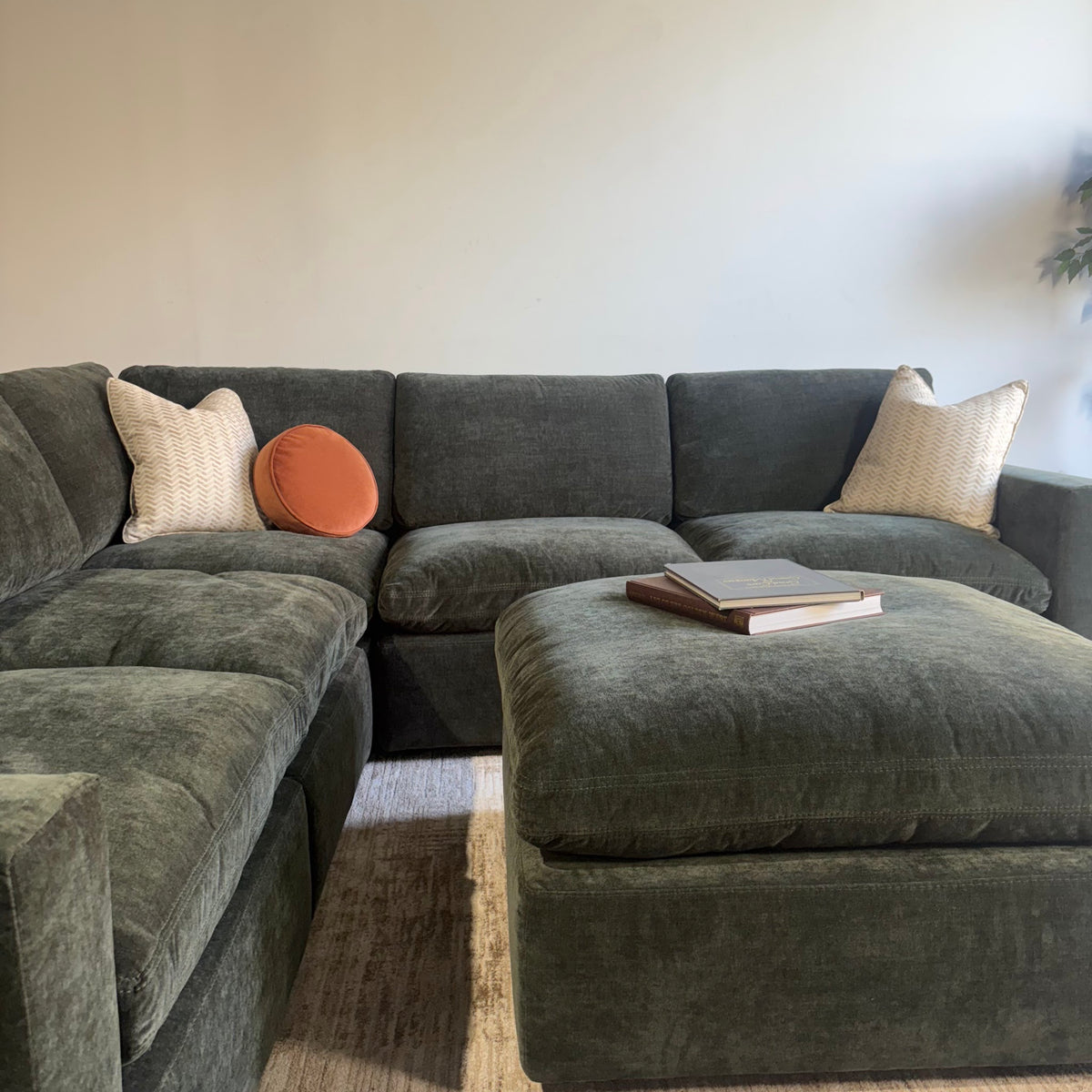 Cypress Corner Sectional + Ottoman in Velvet Forest Green, front close-up