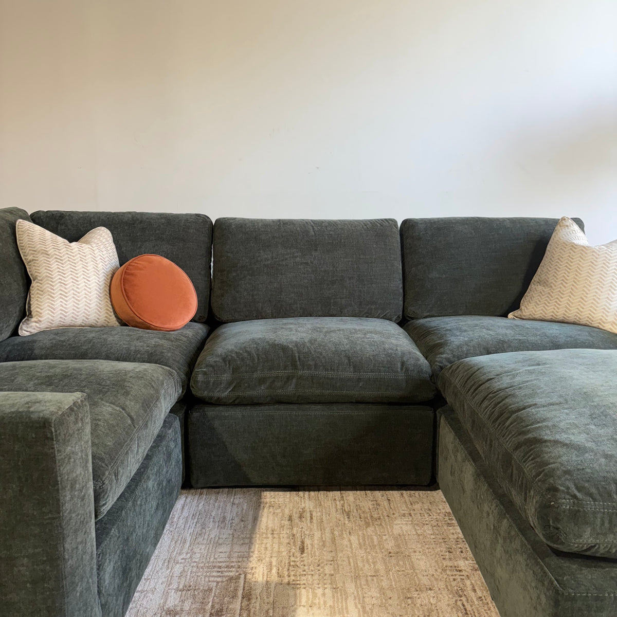 Cypress L-Shape Enclosed + Ottoman in Velvet Forest Green, front close-up