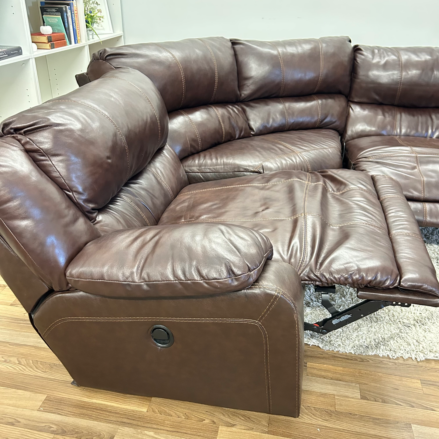 Ashleys Leather Reclining sectional in Brown