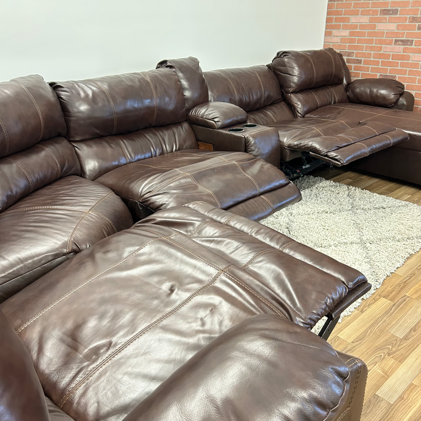 Ashleys Leather Reclining sectional in Brown