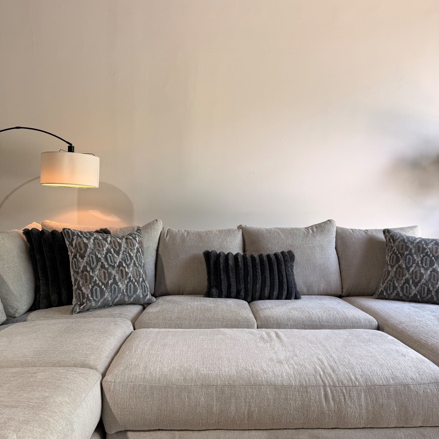 Carter Sectional + Ottoman in Beige Fabric